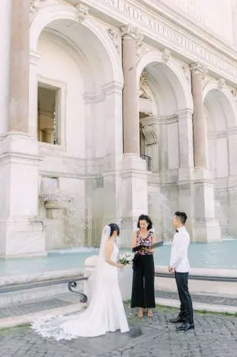 Giusi Celebrant Giusi leading a wedding ceremony at a fountain in Rome