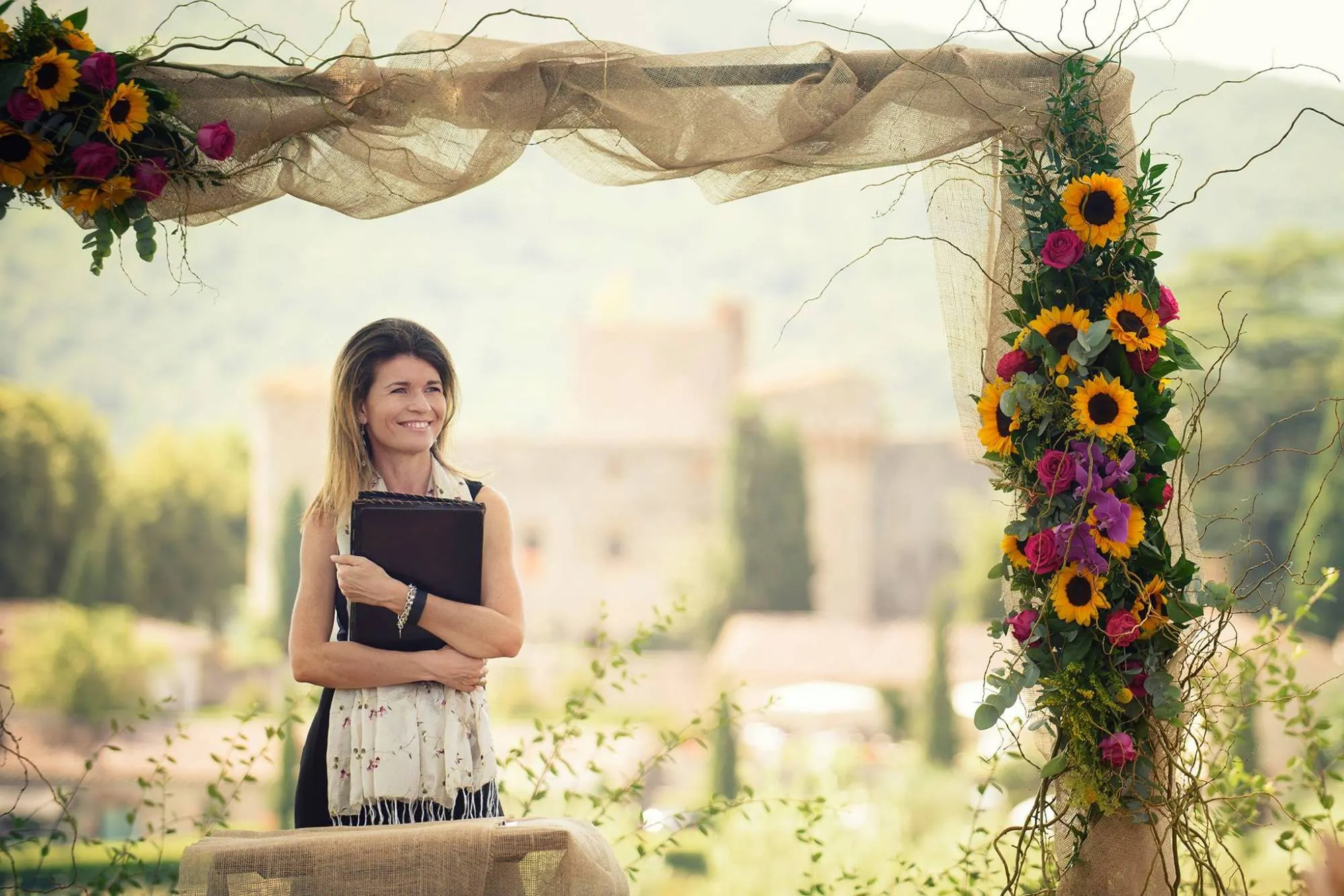 It began with one couple Celebrant waiting under a sunflower arch with a castle behind, before the ceremony