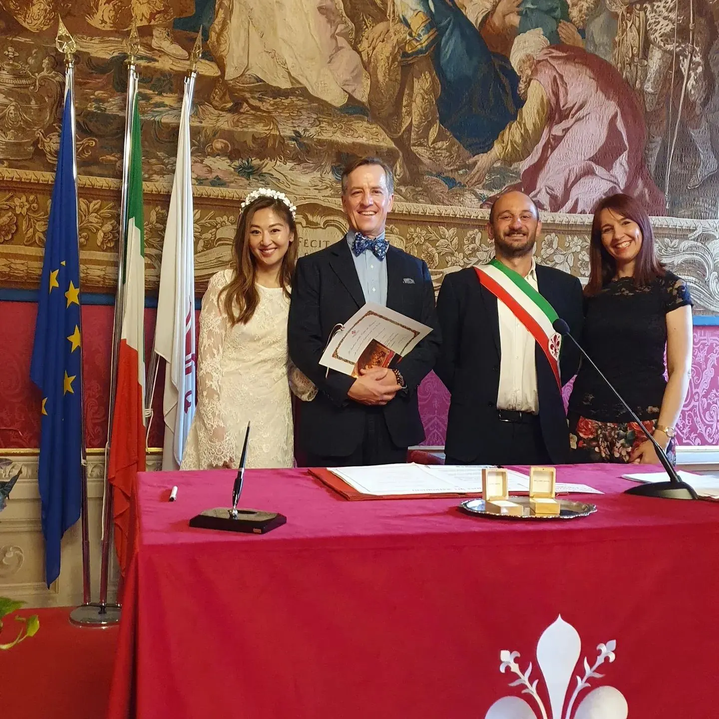 Civil wedding ceremonies in Italy Couple after their civil wedding in Florence with the officiant wearing the tricolour sash and their celebrant