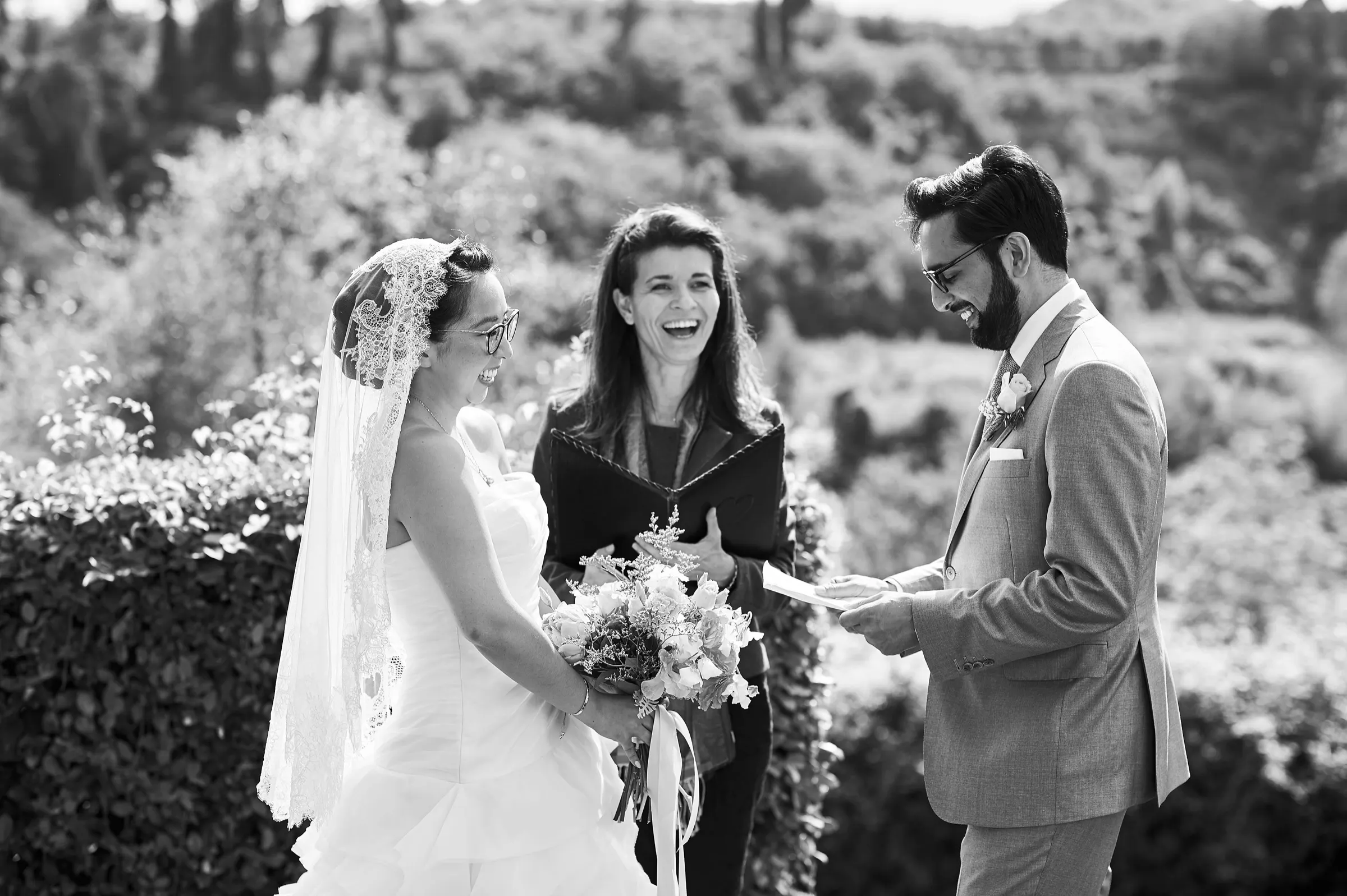 Every IWC ceremony comes with Couple laughing with their celebrant during a symbolic wedding ceremony