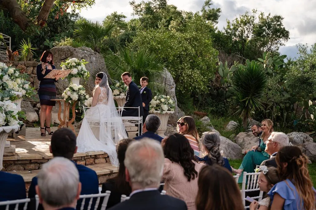 Amalfi Coast Celebrant Alessia leading a wedding ceremony in a Mediterranean garden on the Amalfi Coast