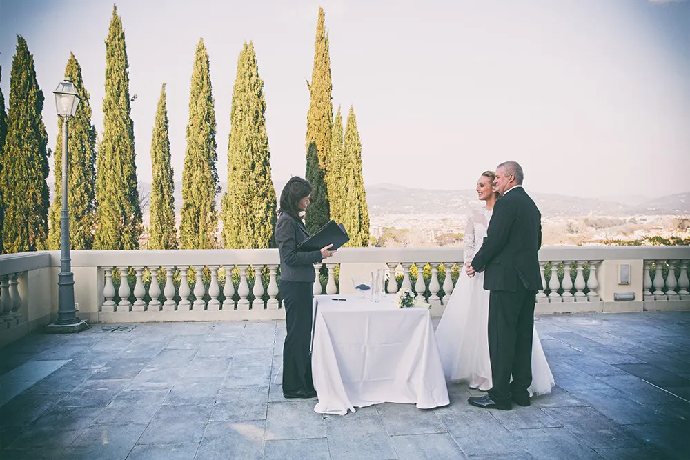 Wedding ceremony on a terrace with cypresses and a view of Florence Wedding ceremony on a terrace with cypresses and a view of Florence